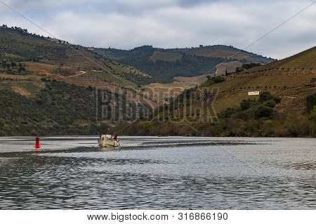 Pinhao, Portugal - June 8, 2019: Scenic View Of The Douro River And Valley With Terraced Vineyards, 