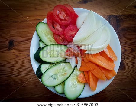Healthy Vegan Salad Condiment Laid On Wooden Table
