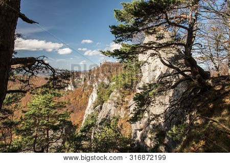 Autumn Sulovske Skaly Mountains From View Point Near Rohac Hill With Rocks, Colorful Forest And Blue