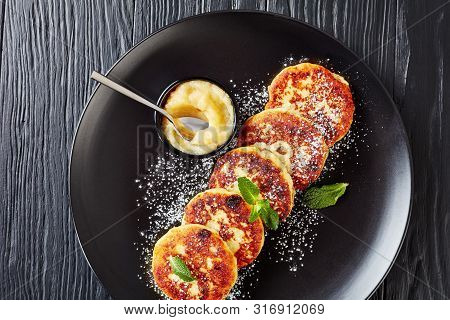 German Quark Potato Pancakes - Quarkkeulchen Sprinkled With Powdered Sugar And Decorated With Mint L