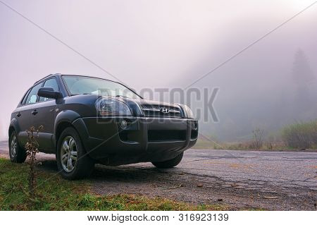 Mizhhirya, Ukraine - Oct 14, 2018: Hyundai Tucson Suv On The Old Cracked Countryside Road Side In Fo