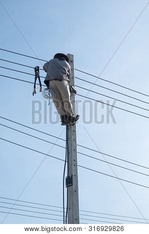 Electricty Power Lines Man Climbing.