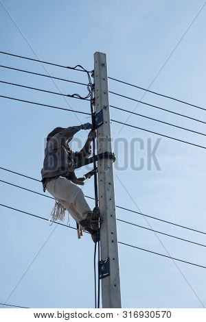 Electricty Power Lines Man Climbing.