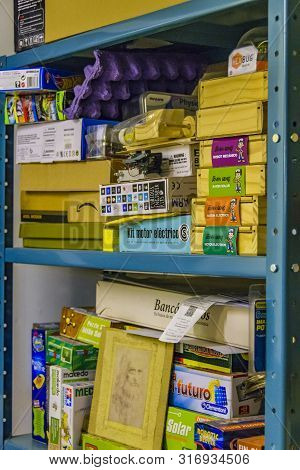 Boxes And Tools At Shelving