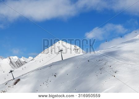 Off-piste Snowy Slope And Chair-lift On Ski Resort At Sunny Day. Caucasus Mountains In Winter, Georg