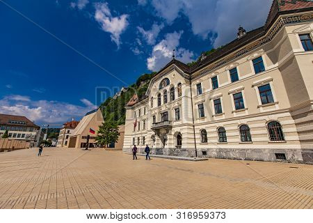 Vaduz, Liechtenstein - May 18, 2018: Unidentified People By Government House Of Liechtenstein In Vad