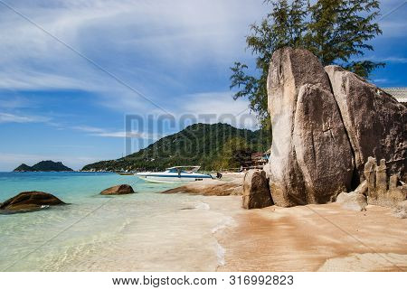 Relax On A Deserted Beach In An Island Of Tropical Paradise. Sand Sairee Beach  With Huge Stones  At