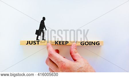 Just Keep Going Symbol. Wooden Blocks With Words 'just Keep Going'. Beautiful White Background, Busi