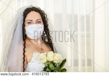 A Jewish Bride In A Synagogue Before A Huppa Ceremony During A Pandemic, Wearing A Medical Mask And 