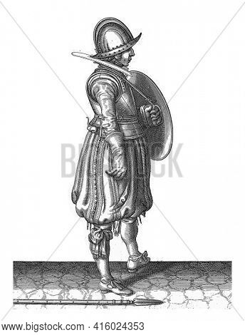 The exercise with shield and spear: the soldier with the shield ready and the spear next to his right foot on the ground, vintage engraving.