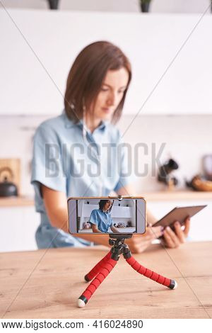 Young Woman Record Video At Kitchen. Self Portrait In Home. Blogger Selfie Video. Female Person. Lif