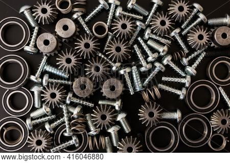 Background With Mechanical Components, Gears, Springs, Screws, Industrial Objects