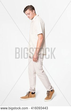 Man in beige shirt and pants casual wear fashion full body