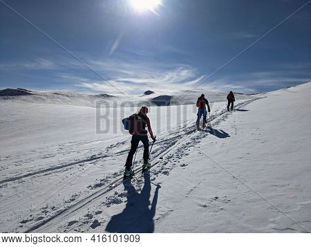Hiking On Skis On The Great Swiss Mountains. Fantastic View In Winter Time. Ski Touring Couple. Ski 