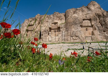 Sandstone Rock With Carved Tombs Of Persian Kings In Necropolis, Iran. King Burial Site Of Ancient P