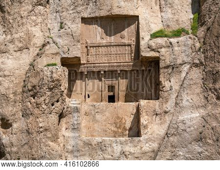 Sandstone Rock With Carved Tombs Of Persian Kings In Necropolis, Iran. King Burial Site Of Ancient P