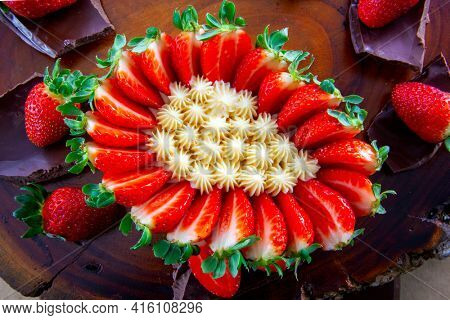 Brazilian easter egg stuffed with strawberry and cream, tasted with a spoon. Easter tradition in Brazil