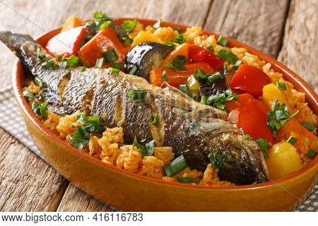 One-pot Thieboudienne Traditional West African Fish And Rice Dish With Vegetables Closeup In The Dis