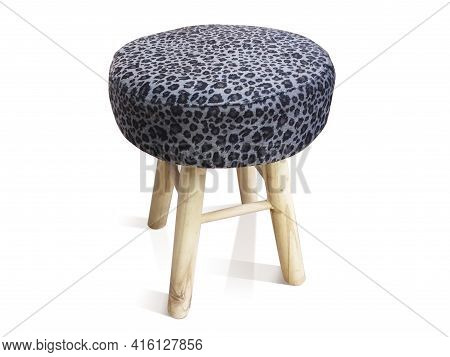 Round Stool With Wooden Legs And Seat Covered With Gray Ethnic Fabric Isolated On White Background. 