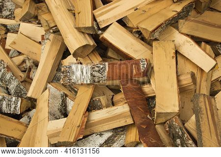 Freshly Cut Birch Firewood. Firewood Background. Pile Of Firewood
