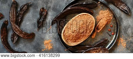 Dry Carob Pods And Powder Top View