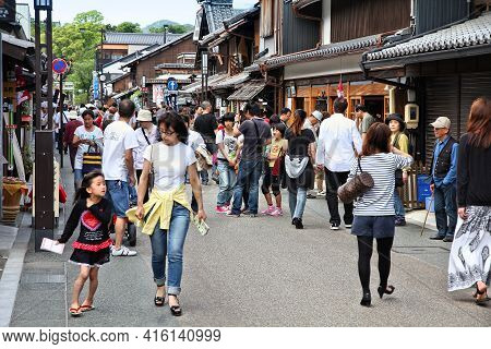 Inuyama, Japan - May 3, 2012: People Walk In Inuyama, Japan. Inuyama Is Among Most Important Tourism