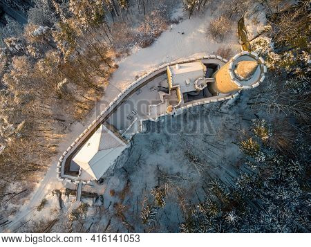 Aerial View Of Medieval Castle Kokorin In Winter During Sunrise. National Park Kokorinsko Nearby Pra