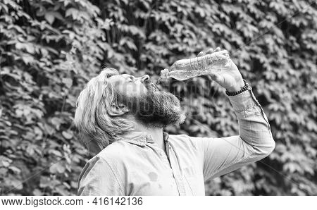 Drain The Bottle. Daily Intake Of Water. Thirsty Male Model Enjoying Refreshing Drink. Healthy Eatin