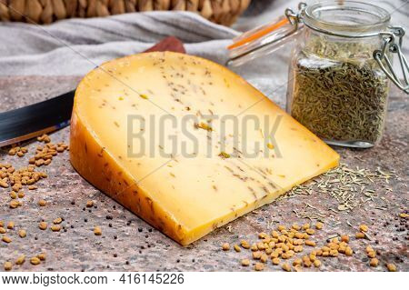 Cheese Collection, Piece Of Hard Yellow Dutch Gouda Cheese With Dried Caraway Or Cumin Seeds