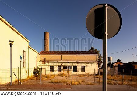 Abandoned Factory Facade Whit Closed Windows, Italy