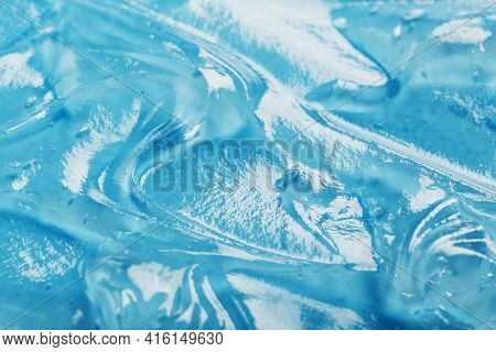 Antiseptic Gel On A Blue Background In Waves.
