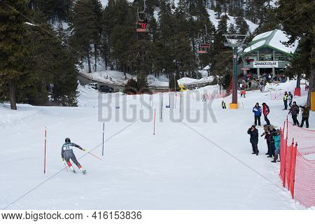 Troodos, Cyprus, February 20 2019: Skier Athletes Skiing At Troodos Mountains During Ski Competition