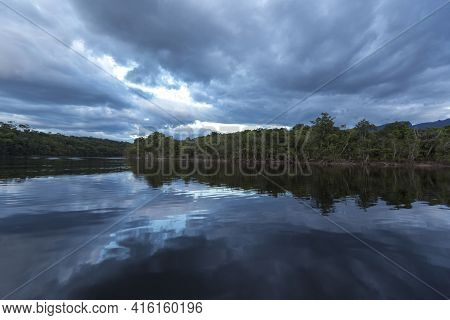 Sunset In The Canaima National Park And Reflections In The Water Of The Gauja River. Bolivar State, 