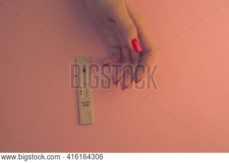 Girl With Bright Red Manicure Doing A Coronavirus Test. A Blood Test To Determine The Infection At H