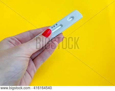 Medical Procedures. Coronavirus Test On A Bright Yellow Background. New Home Self-diagnosis Kit. Gir