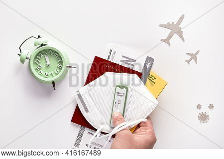 New Normal Travel During Covid-19 Pandemics. Time To Fly Again. Hand Holds German Passport, Boarding