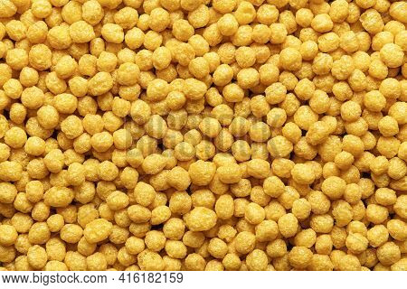 Honey Pops Breakfast Cereals Background, Flat Lay. Full Frame With Cornflakes. Delicious Corn Cereal