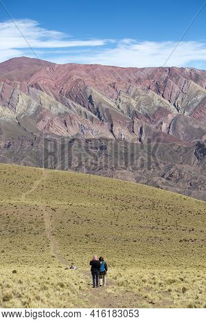 Humahuaca, Argentina, Dec 21: Undefined Group Of Tourists Walking Towards The Mountain Of Fourteen C