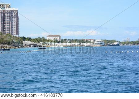 CEBU, PHILIPPINES - APRIL 5, 2016: Shangri-La Mactan Resort and Spa seen from the water. The luxury resort features a Marine Sanctuary.