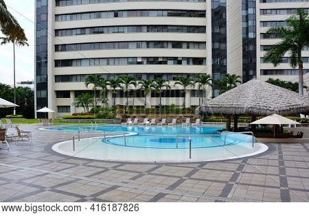 GUAYAQUIL, ECUADOR - FEBRUARY 15, 2017:  Wyndham Hotel Guayaquil Pool. The hotel is situated just steps from the historic Santa Ana Hill and its famous Lighthouse.