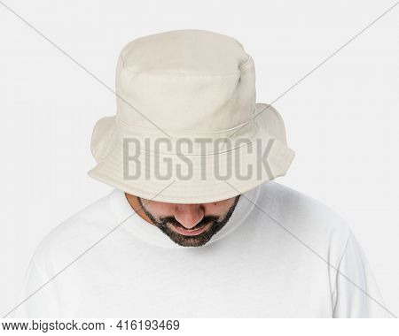Man wearing bleached bucket hat, front view