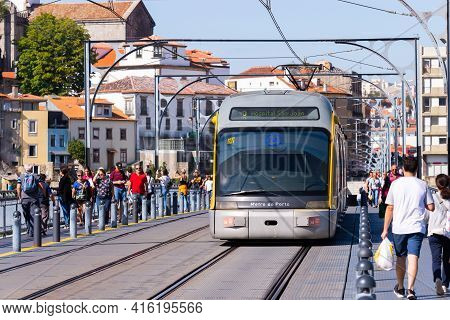 Porto, Portugal, October 06, 2018: Porto Oporto Metro Subway Tram Rain Train Railway Rail At Bridge 