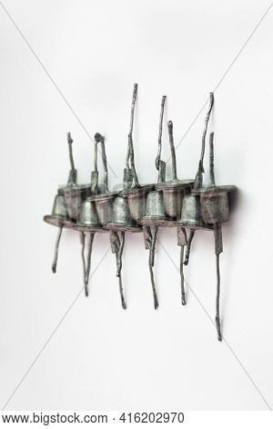 Row Of Rectifier Diodes. Old Electronic Components, Look Like Hats