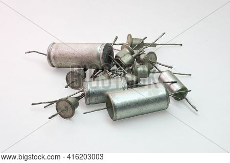 Bunch Of Electronic Components From Retro Audio Equipment. Rectifier Diodes And Metal-paper Capacito