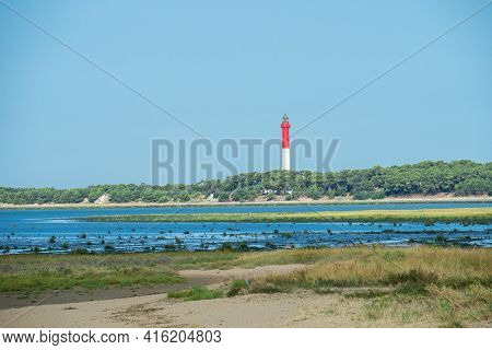 View From La Palmyre Over The Bay Towards The Famous Beacon La Coubre, France