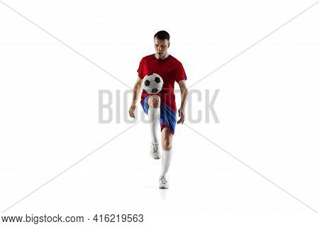 Porttrait Of Young Soccer Football Player Training Isolated On White Background.
