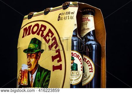 6 Pack Of Birra Moretti Beer On Wooden Barrel With Dark Background. Illustrative Editorial Photo Buc