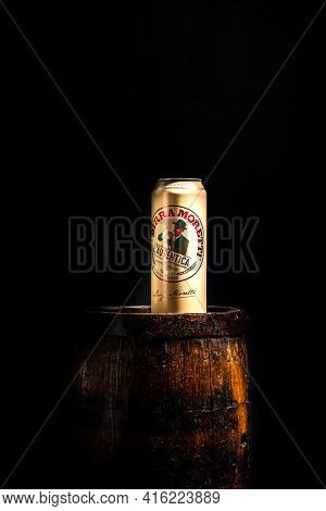 Can Of Birra Moretti Beer On Wooden Barrel With Dark Background. Illustrative Editorial Photo Buchar