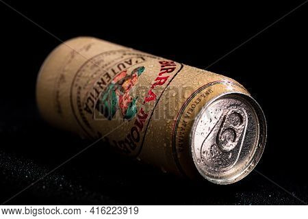 Birra Moretti, A Premium Lager Beer With Water Droplets On Black Background. Studio Photo Shoot In B