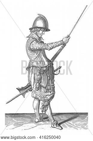 A soldier, full-length , to the right, holding a rudder (a particular type of firearm) by the left thigh with his left thigh and sliding the ramrod into the barrel holder, vintage engraving.
